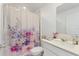 Clean bathroom with a floral shower curtain and modern vanity at 656 Daring Dr, Davenport, FL 33837