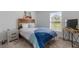 Cozy bedroom with a double bed, nightstand and TV at 656 Daring Dr, Davenport, FL 33837