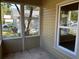 Screened porch with tiled floor and view at 722 Mckenzie St, Leesburg, FL 34748