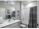 Clean bathroom with a shower/tub combo and gray accents at 2380 Sirena Ln, Mount Dora, FL 32757