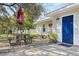Relaxing backyard patio with table, chairs, and umbrella, perfect for outdoor dining at 218 Ann St, Lady Lake, FL 32159