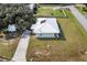 Aerial view showcasing the house, yard, and nearby structures at 218 Ann St, Lady Lake, FL 32159