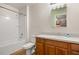 Bathroom with single sink vanity and tub at 218 Ann St, Lady Lake, FL 32159