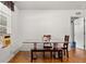Bright dining area with table, bench, and chairs at 218 Ann St, Lady Lake, FL 32159