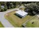 Aerial view showing house, yard, and quiet neighborhood at 218 Ann St, Lady Lake, FL 32159