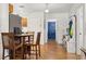 Home entryway with wood floors and blue door at 218 Ann St, Lady Lake, FL 32159