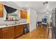 Kitchen with wood cabinets, a stainless steel sink, and a window overlooking the backyard at 218 Ann St, Lady Lake, FL 32159