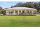 Charming one-story house with metal roof and porch at 218 Ann St, Lady Lake, FL 32159