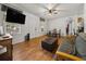 Open living and dining space with wood-look floors and a comfy couch at 218 Ann St, Lady Lake, FL 32159