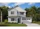 Two-story home with light grey siding and teal door at 6225 Trailblaze Bnd, Saint Cloud, FL 34771