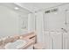 Bathroom with dual walk-in tubs and a vanity at 1243 Tangerine Cir, Lady Lake, FL 32159