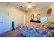 Spacious bedroom with ceiling fan and access to bathroom at 4300 Hammersmith Dr, Clermont, FL 34711