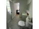 Clean bathroom with toilet, vanity and view of bedroom at 620 Gould St, Eustis, FL 32726
