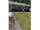 Ranch style home with brick and gray siding, featuring a spacious yard at 620 Gould St, Eustis, FL 32726