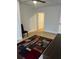 Bright bedroom with light flooring and access to other rooms at 620 Gould St, Eustis, FL 32726
