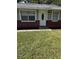 House front view, featuring a gray exterior, and a well-maintained lawn at 620 Gould St, Eustis, FL 32726