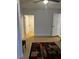 Spacious bedroom with light walls, wood-look flooring, and access to other rooms at 620 Gould St, Eustis, FL 32726