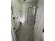 Clean bathroom, featuring a walk-in shower and white vanity at 620 Gould St, Eustis, FL 32726