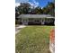 One-story house with gray siding and brick accents at 620 Gould St, Eustis, FL 32726