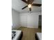 Well-lit bedroom featuring a spacious closet and wood-look floors at 620 Gould St, Eustis, FL 32726