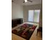 Bright bedroom with a large window and a comfortable sitting area at 620 Gould St, Eustis, FL 32726