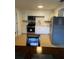 Bright kitchen with white cabinets, stainless steel appliances, and light-colored countertops at 620 Gould St, Eustis, FL 32726