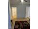 Bright hallway with light-colored wood flooring and access to other rooms at 620 Gould St, Eustis, FL 32726