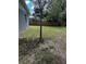 View of backyard with a tree and wooden fence at 620 Gould St, Eustis, FL 32726