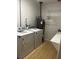 Laundry room with washer, dryer, and shelving at 620 Gould St, Eustis, FL 32726