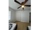 Well-lit bedroom featuring a spacious closet and wood-look floors at 620 Gould St, Eustis, FL 32726