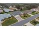 Aerial view of house and surrounding neighborhood at 5729 King James Ave, Leesburg, FL 34748