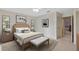 Spacious main bedroom with king bed and access to bathroom at 5729 King James Ave, Leesburg, FL 34748