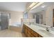 Spacious bathroom with double vanity and soaking tub at 5729 King James Ave, Leesburg, FL 34748