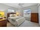 Cozy bedroom with a queen bed and window at 5729 King James Ave, Leesburg, FL 34748