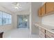 Bright breakfast nook with access to the screened porch at 5729 King James Ave, Leesburg, FL 34748