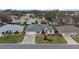 Aerial view of single-story house, landscaping, and neighborhood at 5729 King James Ave, Leesburg, FL 34748