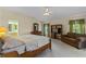 Large main bedroom with carpeted floors and lots of natural light at 5729 King James Ave, Leesburg, FL 34748