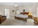 Spacious main bedroom with ensuite bathroom and sitting area at 5729 King James Ave, Leesburg, FL 34748