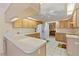 Functional kitchen offering lots of counter space and wood cabinets at 5729 King James Ave, Leesburg, FL 34748
