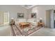 Spacious living room with large sectional sofa and high ceilings at 5729 King James Ave, Leesburg, FL 34748