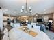 Open concept dining room with views into the kitchen and living areas at 518 Narrow View Ln, Groveland, FL 34736