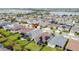 Aerial view of house in a residential neighborhood at 518 Narrow View Ln, Groveland, FL 34736