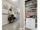 Organized hallway closet with shelves for storage at 518 Narrow View Ln, Groveland, FL 34736