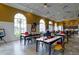 Bright and airy art studio with tables, chairs and plenty of natural light at 518 Narrow View Ln, Groveland, FL 34736