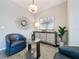 Elegant sitting area with comfortable armchairs and stylish decor at 518 Narrow View Ln, Groveland, FL 34736