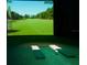 Golf simulator room with large screen and hitting bays at 518 Narrow View Ln, Groveland, FL 34736