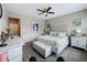 Main bedroom with a king-size bed and elegant decor at 518 Narrow View Ln, Groveland, FL 34736