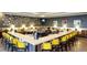 Community bar with a corner bar and yellow chairs at 518 Narrow View Ln, Groveland, FL 34736