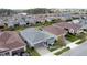 Aerial view of a house in a residential neighborhood at 518 Narrow View Ln, Groveland, FL 34736