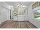 Bright dining area with built-in hutch and window view at 1020 Hilltop Rd, Tavares, FL 32778